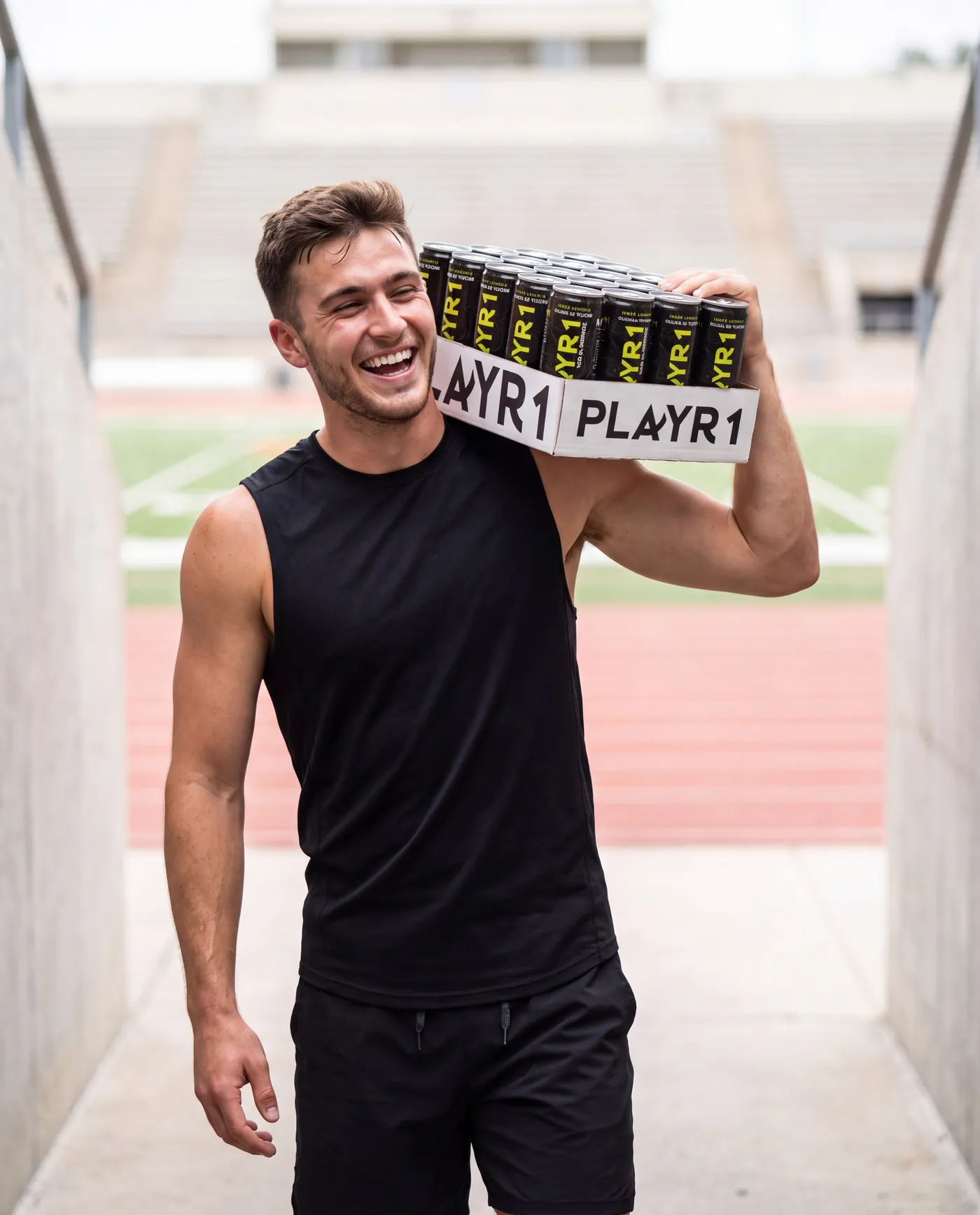 Athlete carrying a PLAYR1 case through a stadium tunnel